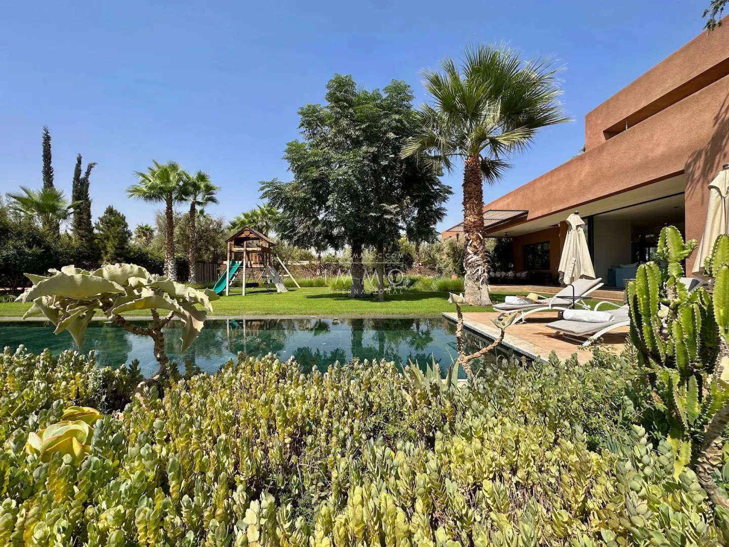 Luxury contemporary villa with infinity pool for sale on the ourika road in marrakech.