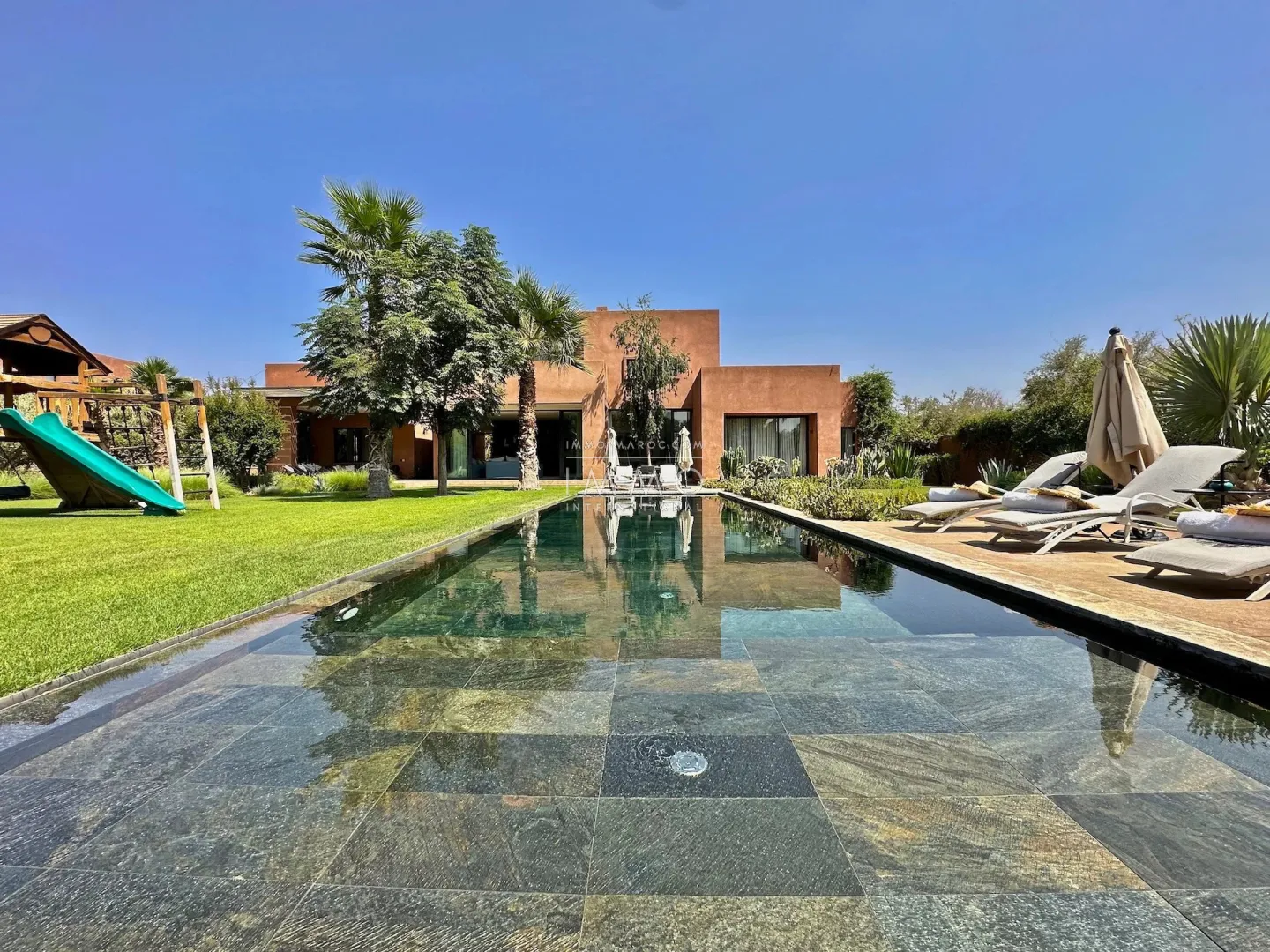 Luxury contemporary villa with infinity pool for sale on the ourika road in marrakech.